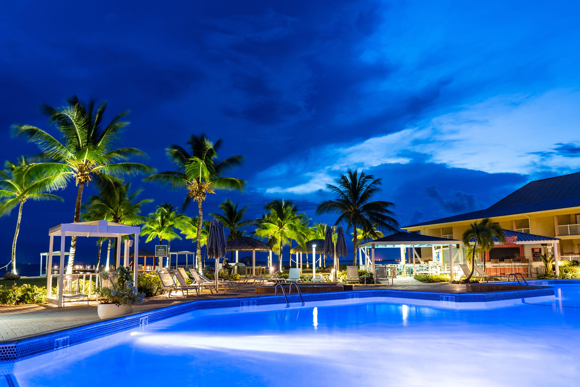 Grand Caymanian Resort pool at night.