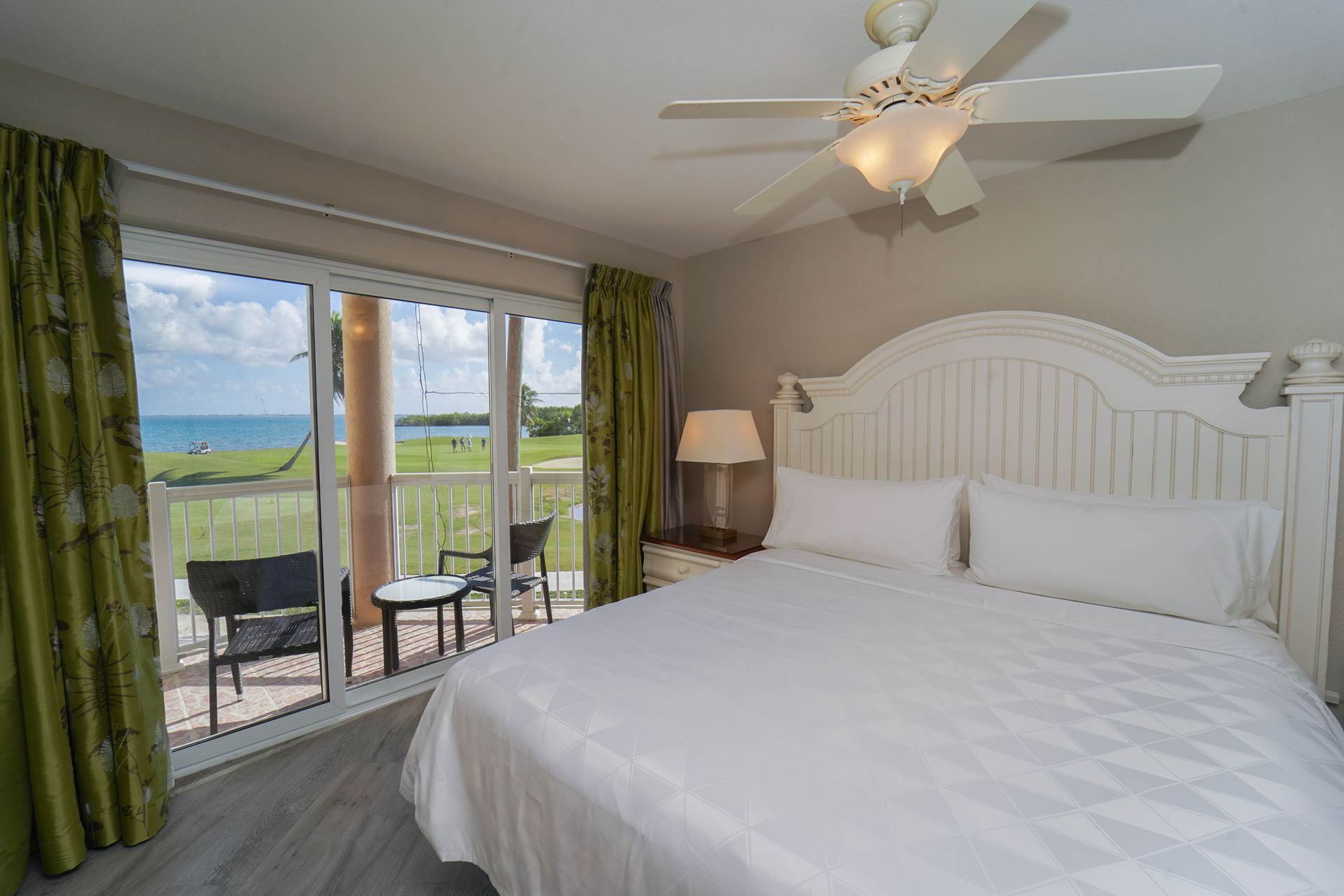 Guest room bed at Grand Caymanian Resort.