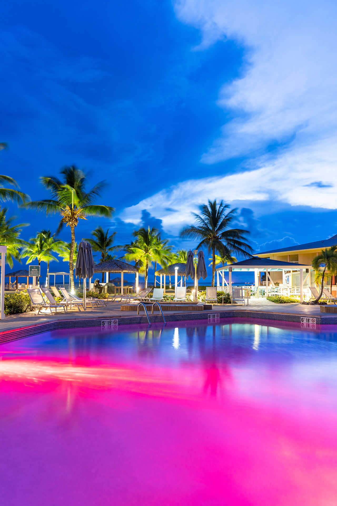 The pool of the Grand Caymanian resort at dusk.