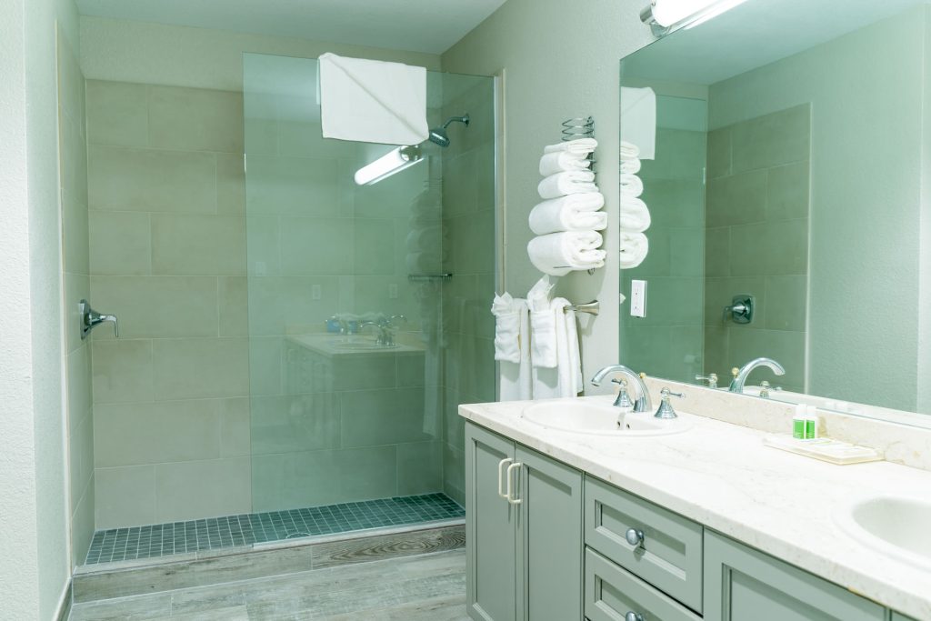 Bathroom vanity and shower in the Studio Suite at the Grand Caymanian Resort.