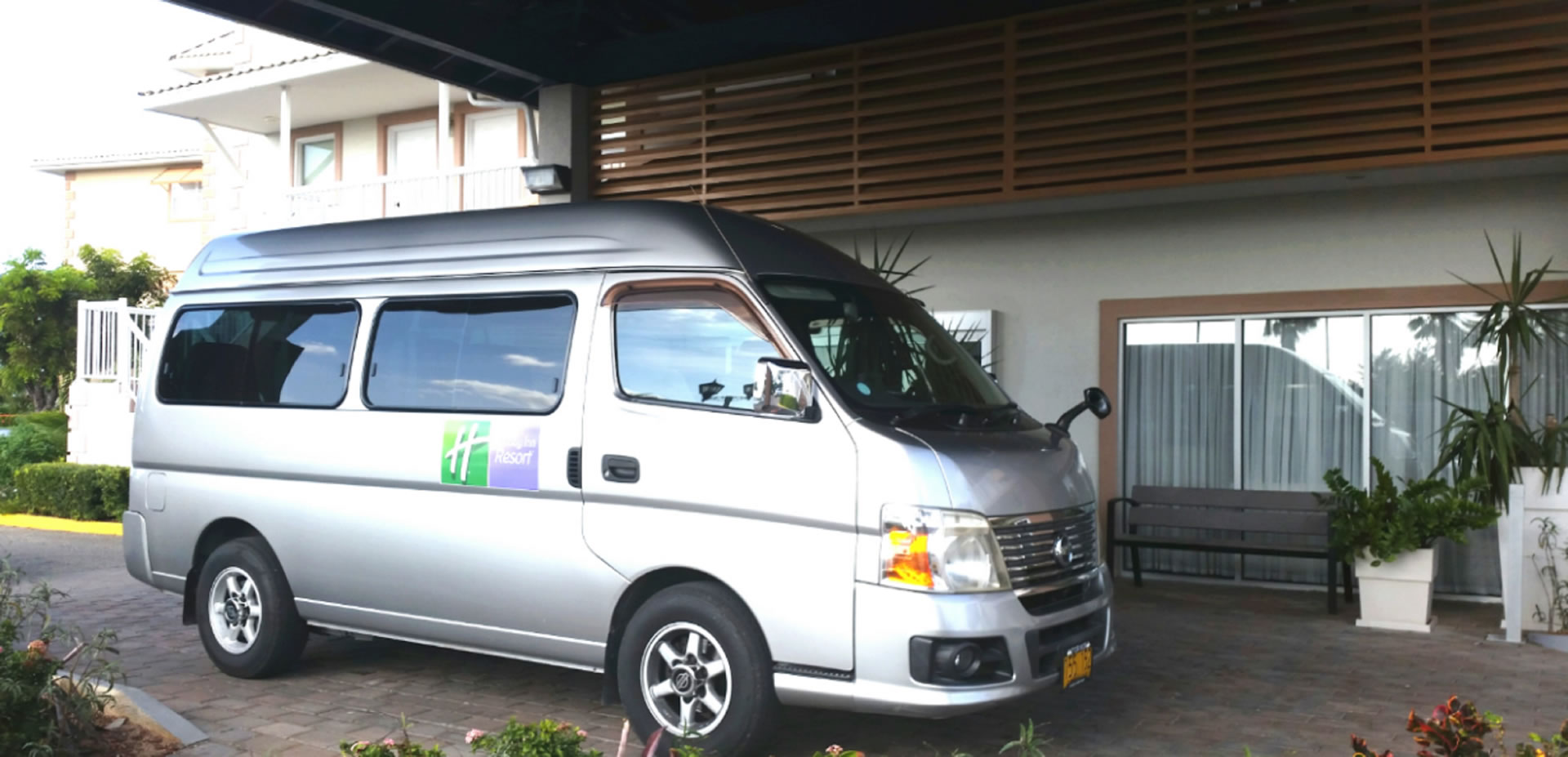The shuttle van at the entrance of the Grand Caymanian Resort.