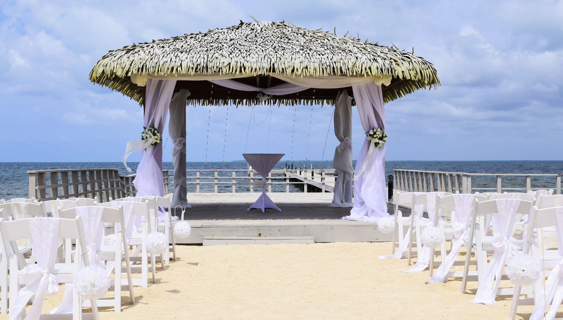 A cabana next to the fishing pier at the Grand Caymanian Resort that has been fashioned to be a wedding altar.