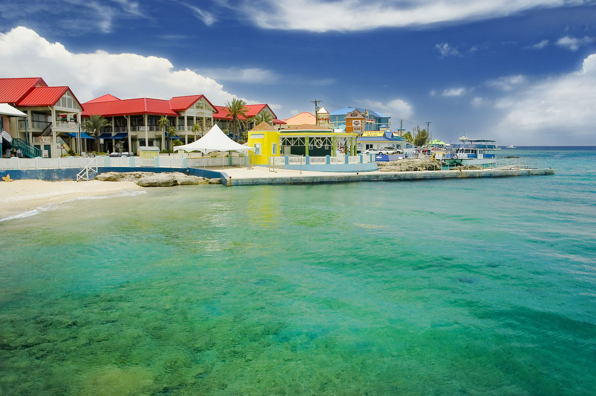 The pristine waters and colorful buildings of George Town, capital of the Cayman Islands.