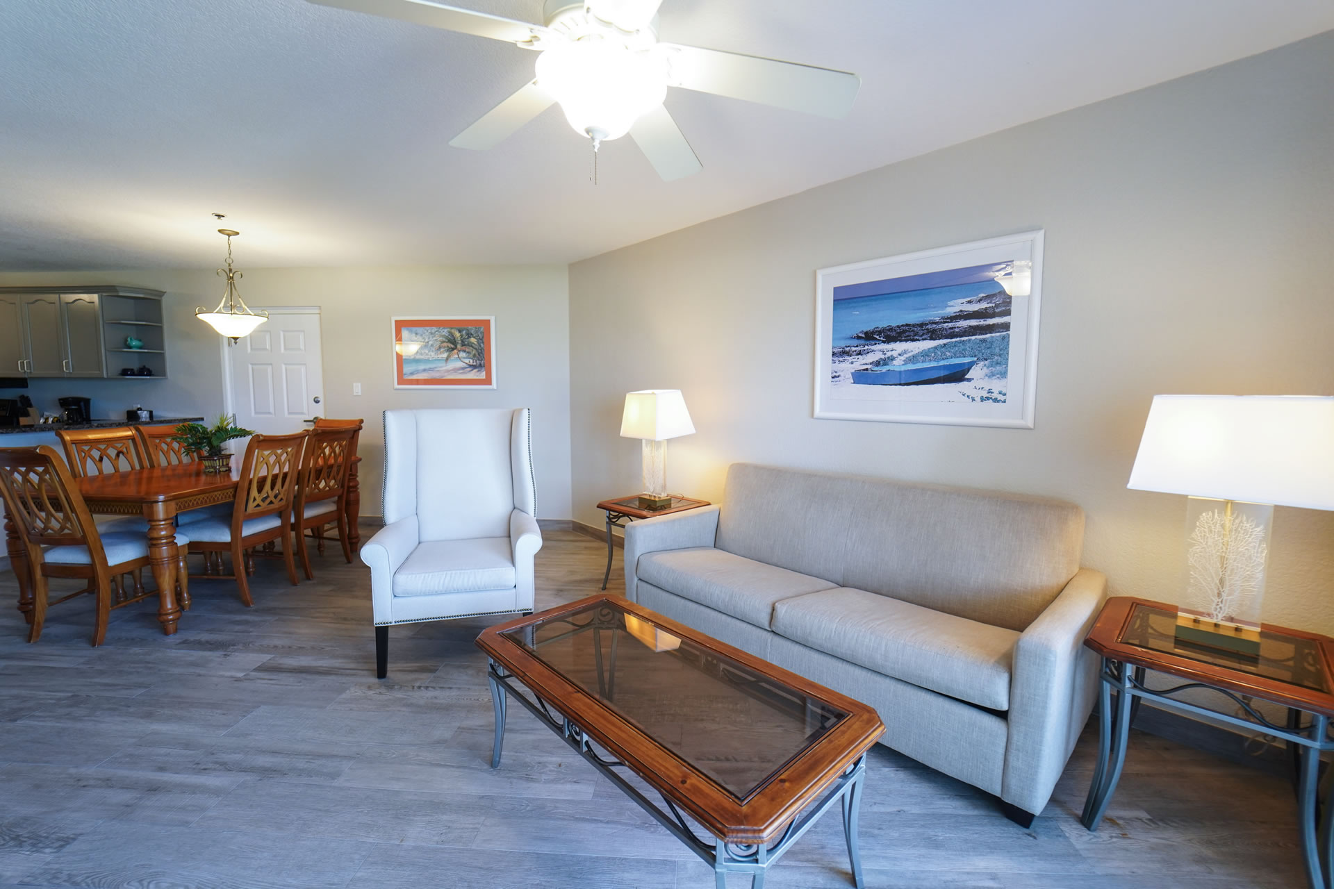Living room and dining room table in the One Bedroom King Suite at the Grand Caymanian Resort.