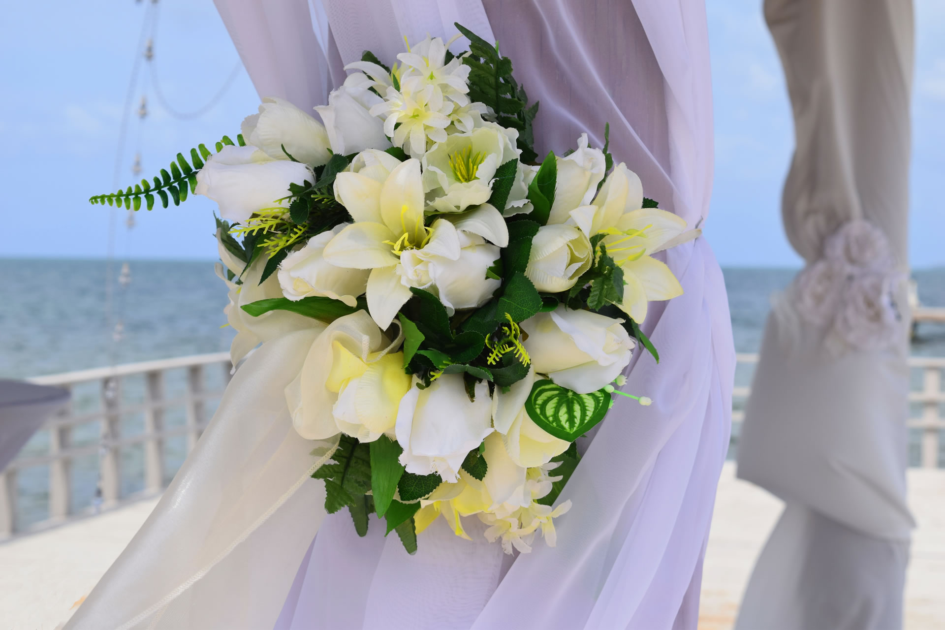 A bouquet of white flowers for a wedding ceremony.